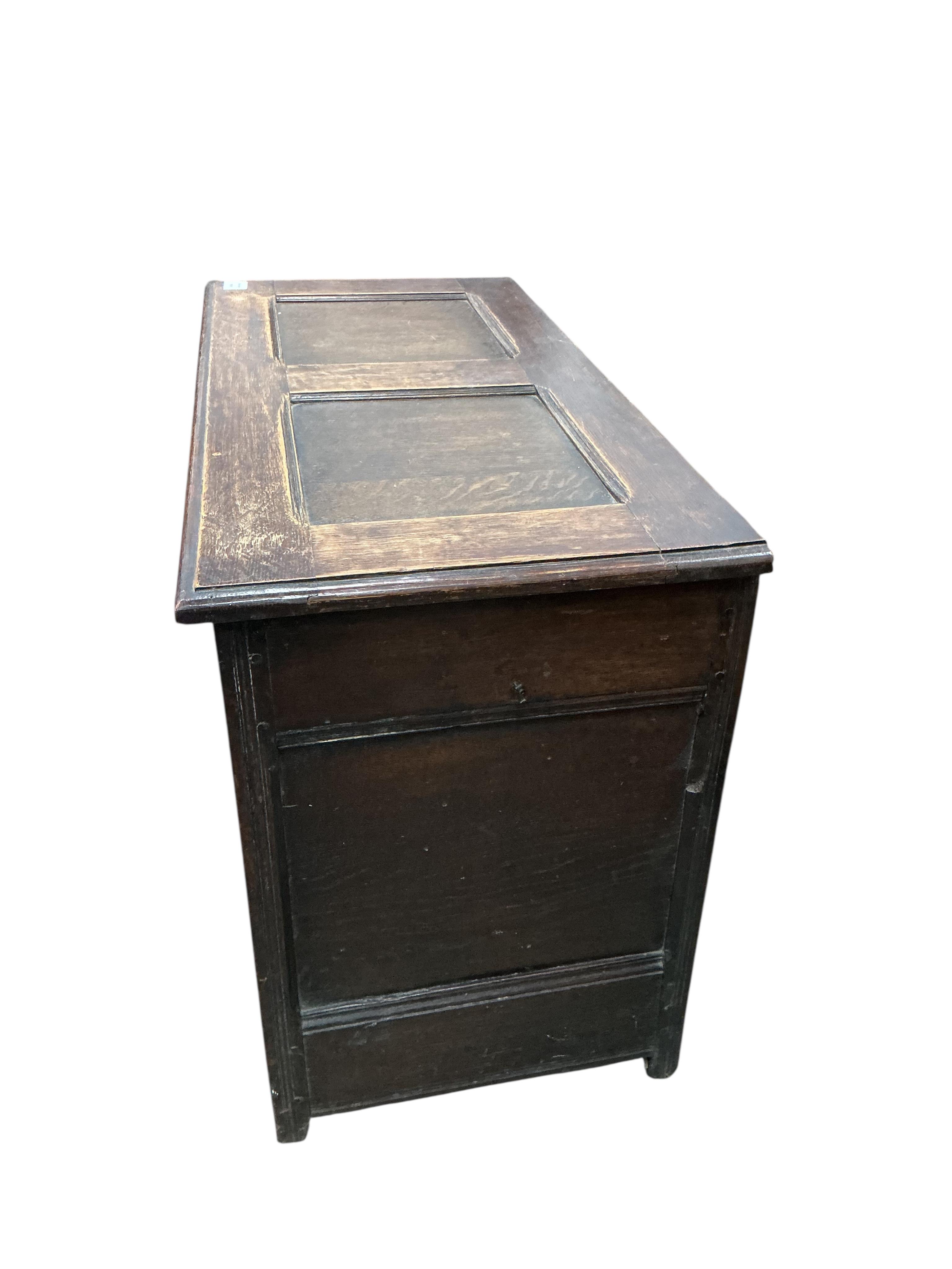 A small 18th century style panelled oak coffer, width 94cm, depth 45cm, height 66cm